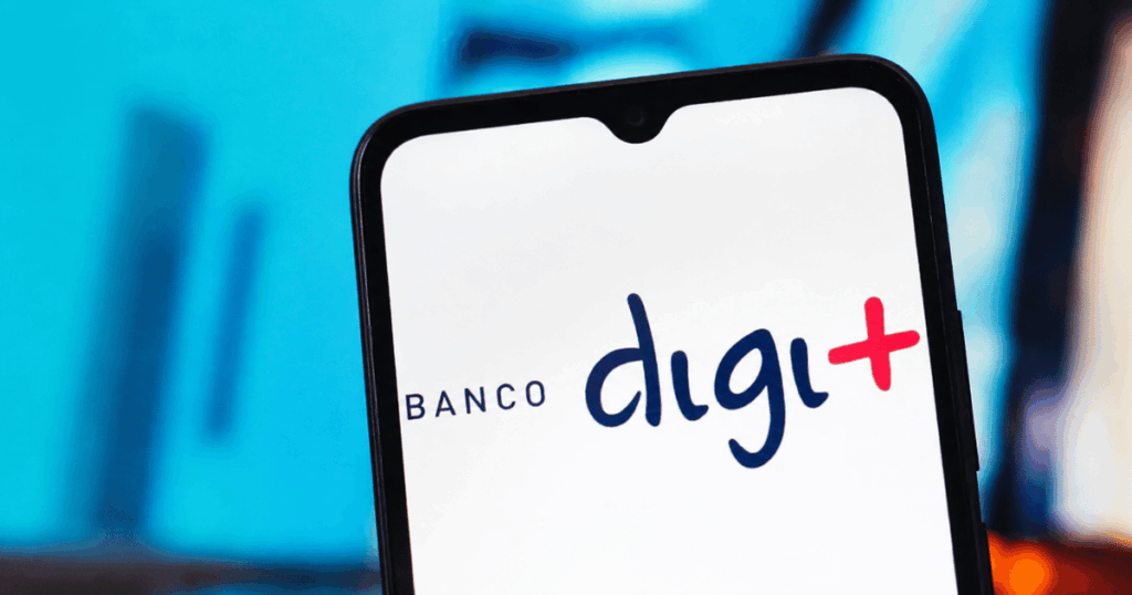 Logo do Banco Digimais exibido na tela de um smartphone durante investigação da PF sobre créditos ligados à Vale.