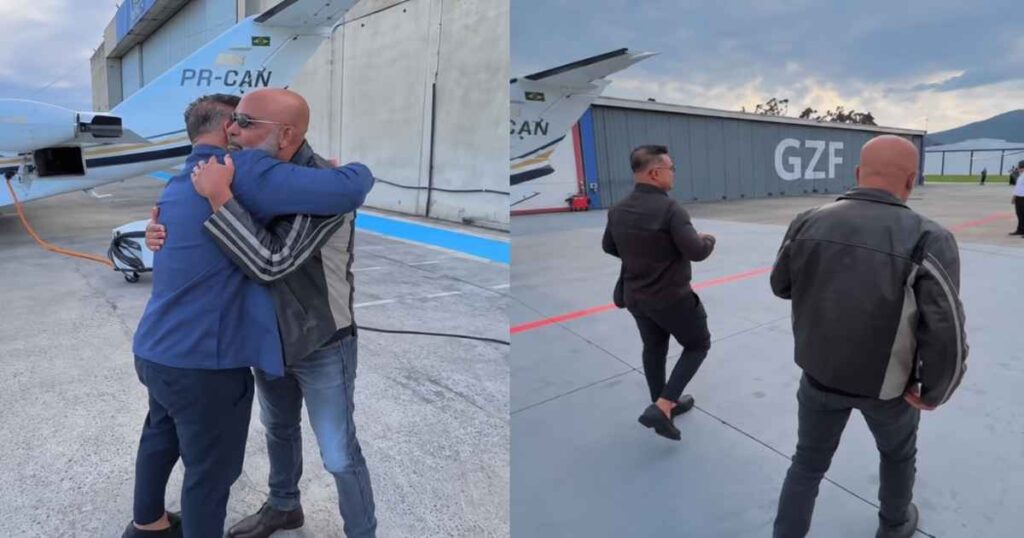 Rick, da dupla com Renner, aparece em área de hangar antes de embarque em Santa Catarina.